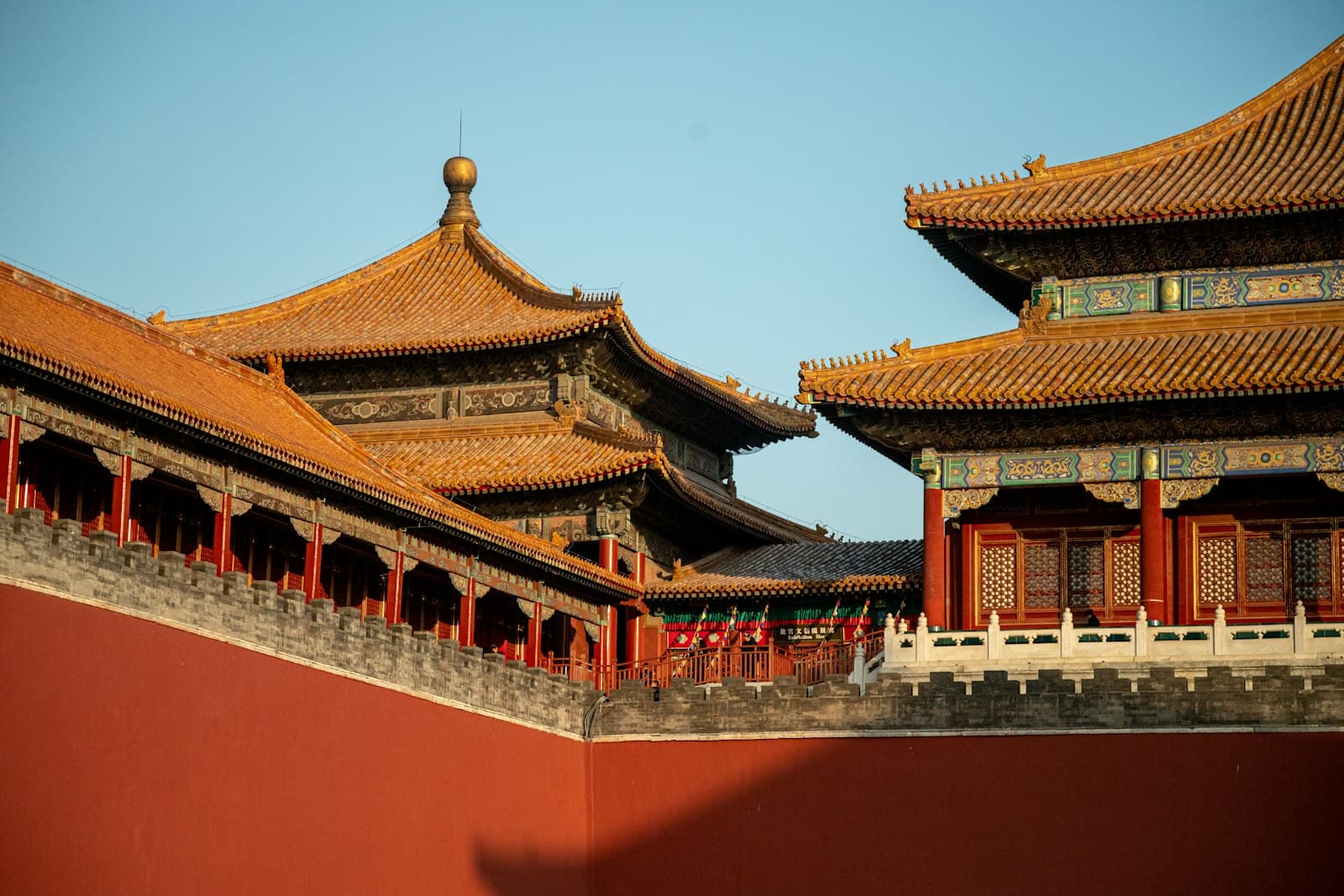 Red walls and golden roofs of the Forbidden City in Beijing